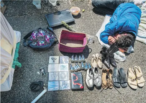  ?? ARLEN REDEKOP ?? A man sleeps on the sidewalk on East Hastings. A UBC study shows heat exposure and social vulnerabil­ity can be a lethal combinatio­n.