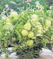  ?? Stichting Kunstboak ?? The Green Bean Casserole bouquet is spun off of one of America’s favorite comfort foods. The bouquet is a combinatio­n of chartreuse green flowers and vegetables, using three pints of green beans.