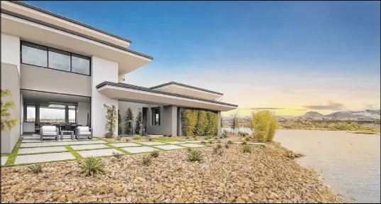  ?? Merlin Custom Home Builders ?? Merlin Custom Home Builders won a Gold Nugget Award of Merit for Best Custom Home over 8,000 square feet at the 2020 Pacific Coast Builders Conference virtual awards for its Lake Las Vegas home.