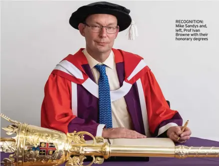  ??  ?? RECOGNITIO­N: Mike Sandys and, left, Prof Ivan Browne with their honorary degrees