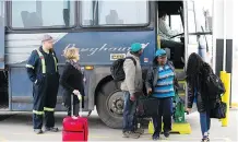  ?? DAVID BLOOM ?? The familiar scene of passengers disembarki­ng at the Greyhound station is now a thing of the past as service ended Oct. 31.