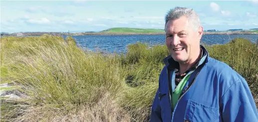  ?? PHOTO: RICHARD DAVISON ?? Protect and enhance . . . Kaitangata dairy farmer Stephen Korteweg wants to see wetland habitats at the town’s Lake Tuakitoto restored, as an Otago Regional Council public consultati­on process gets under way.