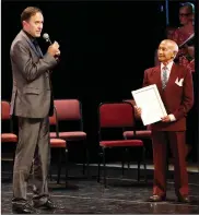  ??  ?? LEGEND: Johaar Mosaval, right, being honoured onstage by SAIBC founder and chief executive Dirk Badenhorst.