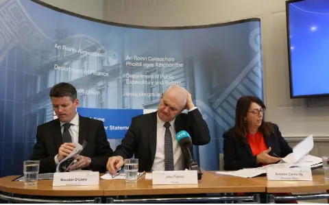  ??  ?? MEASURE OF THE ECONOMY: Assistant Principal Officer Brendan O’Leary (left), and Principal Officers John Palmer and Annette Connolly at the Department of Finance press conference to release the Exchequer returns for the second quarter. Photo: Sam Boal