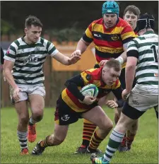  ??  ?? Scramble defence from Greystones in horrible conditions.