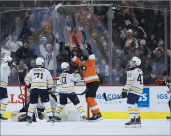  ?? MATT SLOCUM – THE ASSOCIATED PRESS ?? The Flyers’ James van Riemsdyk, center, celebrates one of his two goals Thursday night amid a 6-1 blowout of the Buffalo Sabres at Wells Fargo Center.