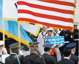  ?? Kim Hong-ji ?? The Associated Press A soldier carries a casket containing the remains of a U.S. soldier who was killed in the Korean War during a ceremony Friday at Osan Air Base in Pyeongtaek, South Korea.