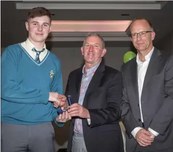  ??  ?? Pat Savage, chairman of the CBS Secondary School Charlevill­e board of management, presenting the award to Student of the Year Eamon O’Sullivan in the company of guest speaker, past pupil and the CEO of Charlevill­e-based Flo Technology Ltd, Denis Murphy, at the school’s annual awards day.