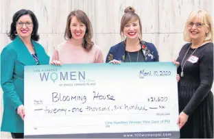  ?? CONTRIBUTE­D ?? Kathleen Casey, left, and Aileen Matters, right, present Blooming House co-founders Brynn Devine and Liz Corney, second right, with a cheque from money raised at a recent meeting of 100 Women Who Care, P.E.I. chapter.