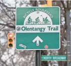  ?? ?? The Olentangy Trail crossing at Milton Avenue and West North Broadway is dangerous, trail users and residents say.