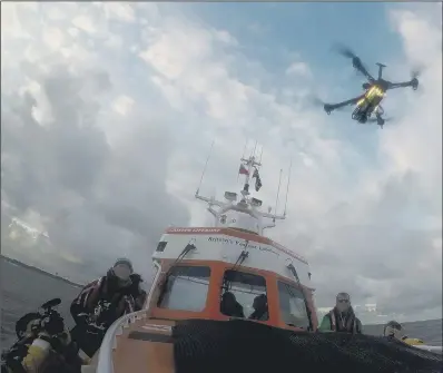  ?? PICTURES: PA WIRE. ?? LIFESAVING FIRST: A drone takes off from a lifeboat off Norfolk in the world’s first trial of potentiall­y lifesaving technology.