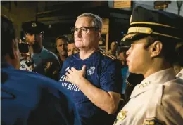  ?? ?? Philadelph­ia Mayor Jim Kenney, center, and police Commission­er Danielle Outlaw, right, speak outside Jefferson University Hospital after two police offers were shot Monday.