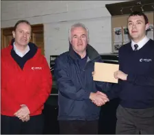  ??  ?? Pat McDonagh and Ronan Marren, Herron Auto Sligo. present a sponsorshi­p cheque to Brian McBride, North Sligo AC.