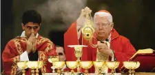  ??  ?? Cardinal Bernard Law (right) celebrates a mourning Mass for the late Pope John Paul II in the Vatican in 2005