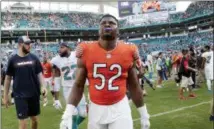  ?? LYNNE SLADKY — THE ASSOCIATED PRESS ?? Bears outside linebacker Khalil Mack (52) walks off the field after Sunday’s game against the Dolphins.