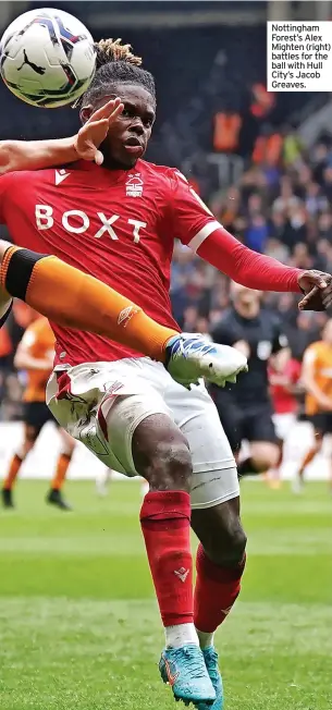  ?? ?? Nottingham Forest’s Alex Mighten (right) battles for the ball with Hull City’s Jacob Greaves.