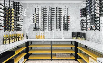  ?? ?? A wine room is one of the many features of this 18,210-square-foot Southern Highlands Golf Club mansion.
