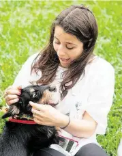  ?? R. Clayton McKee photos / For the Chronicle ?? Scotch and senior Sophie Gaylor, 18, snatched a little play time when K-9 Angels Rescue brought puppies to The Kinkaid School.