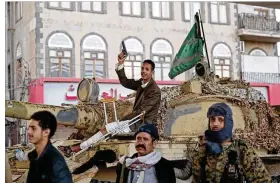  ?? HANI MOHAMMED / AP ?? Houthi Shiite fighters guard a street leading to the residence of former Yemeni President Ali Abdullah Saleh, in Sanaa, Yemen, on Monday. Saleh was killed by Shiite rebels Monday as their forces battled for control of the capital.