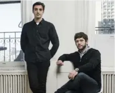  ?? SASHA MASLOV/THE NEW YORK TIMES ?? Rus Yusupov, left, and Colin Kroll co-founded HQ Trivia, which broadcasts a live trivia show where the contestant­s are the thousands watching.