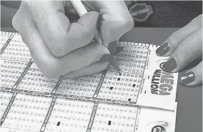  ?? TIM BOYLE/GETTY IMAGES ?? It is no secret that winning the lottery has become the new version of the American Dream, though many fret about the downsides.