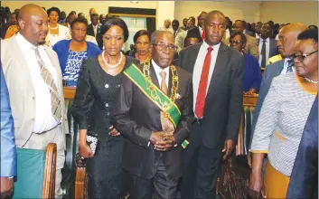  ??  ?? President Mugabe and First Lady Amai Grace Mugabe arrive for the official opening of the Fifth Session of the Eighth Parliament in Harare yesterday
