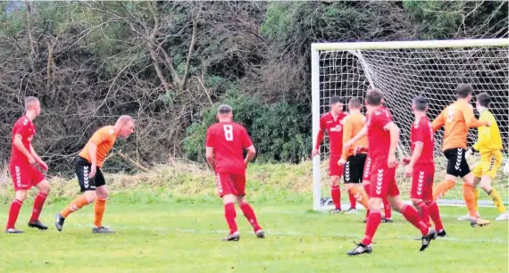  ??  ?? Head man Ryan Duncanson (second left) nets Doune’s opening goal on Saturday against Cambusbarr­on