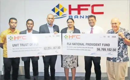  ?? Picture: SUPPLIED ?? HFC Bank handed over dividends to its shareholde­rs Fiji National Provident Fund and Unit Trust of Fiji.