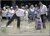  ?? ERIC GAY /ASSOCIATED PRESS ?? Phil Mickelson (left) checks out his lie on the 18th hole during a practice round for the U. S. Open in Pinehurst, North Carolina, on Tuesday. The tournament starts Thursday.