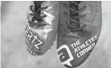  ?? ?? Cardinals tight end Zach Ertz’s cleats represent his Zach Ertz Family Foundation and Athlete's Corner partnershi­p to promote their Score For More meal donation campaign.