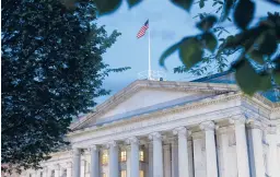  ?? PATRICK SEMANSKY/AP ?? The new law seeks to strengthen the tools used by the Treasury Department to track shell companies. Above, the Treasury Department building in Washington.