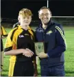  ??  ?? Ashford’s Keevan Doyle collects the Man of the Match award.