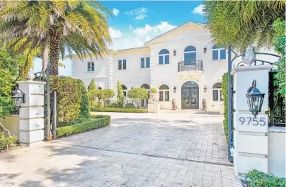  ?? IUSE PHOTOGRAPH­Y ?? The two-story gated mansion at 9755 SW 67th Ave. in Pinecrest has French flair, along with five bedrooms and six baths. Build in 2014, it was intended to be an homage to the Palace of Versailles and its gardens.