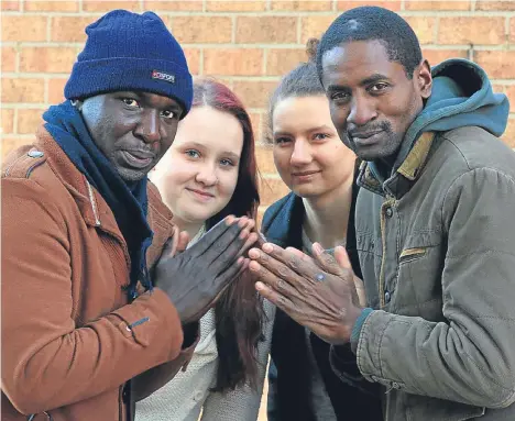  ??  ?? AS temperatur­es plummeted at the weekend there were mixed feelings among some of the internatio­nal students at D&A College.
While John Omondi Ojwang and Paul Aumaodhiam­bo from Kenya went on the hunt for winter woollies, Finnish duo Emma Kananen and...