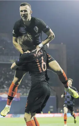  ?? Picture: Reuters ?? HEARTBREAK­ER. Croatia’s Tin Jedvaj celebrates with team-mate Ivan Perisic after hitting the winner in their Uefa Nations League match against Spain at the Stadion Maksimir on Thursday night.