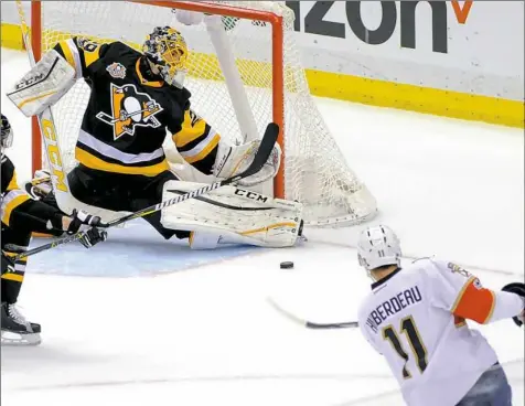  ?? Haley Nelson/Post-Gazette ?? Penguins goalie, Marc-Andre Fleury blocks a shot by Florida's Jonathan Huberdeau on his way to a shutout Sunday at PPG Paints Arena.