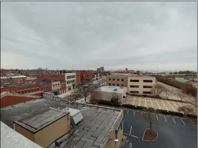  ?? ZACHARY SRNIS — THE MORNING JOURNAL ?? The roof of the former Eagles Building offers a view of businesses on Broadway Avenue and of Black River Landing in Lorain.