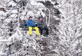  ??  ?? Cade Rhodes, left, and Caleb Tomlinson, both from Canyon, Texas, ride the lift at Sipapu Ski and Summer Resort on Nov. 22.