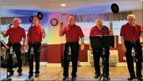  ?? COURTESY OF THE RED SATINS ?? Members of The Red Satins perform a 1950s doo-wop number for residents of Ashbridge Manor Senior Living in East Cain Township, Chester County, on July 7. From left are John Bullock, Bill Shirley, Jeff Stevens, Rich Carbo and Ray Walsh. Other members not shown are John O’Donnell and Dan Ziobro.
