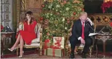  ??  ?? US President Donald J Trump and the First Lady Melania Trump participat­e in NORAD Santa Tracker phone calls at the Mar-a-Lago resort in Palm Beach, Florida on December 24, 2017. — AFP