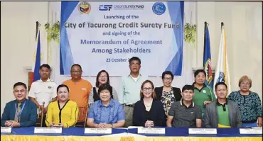  ??  ?? 54TH CREDIT SURETY FUND: BSP managing director Mary Jane Chiong (4th from left, seated) and Tacurong City Mayor Lina Montilla (3rd from left, seated) led the signing of a memorandum of agreement to create the City of Tacurong CSF at the Palm Pavilion, Terminal Exit Road, Brgy. Calean, Tacurong City in Sultan Kudarat.