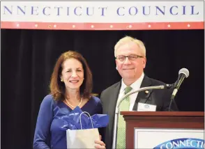  ?? CT Council of Small Towns / Contribute­d photo ?? Bethel First Selectman Matt Knickerboc­ker presents state Rep. Gail Lavielle with the Connecticu­t Council of Small Towns’ Town Crier Award on Feb. 18, for her work last year in helping to fend off efforts to regionaliz­e school districts around the state as well as other work she did in advocating for public policies that benefit Connecticu­t’s small towns.