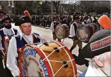  ?? Bill O'Brien / For Hearst Connecticu­t Media ?? Bass drummer Joe Mooney performs on St. Patrick’s Day in New Haven.