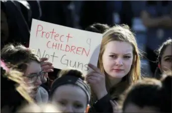  ??  ?? In this Feb. 28, 2018 photo, Somerville High School junior Megan Barnes marches with others during a student walkout at the school in Somerville, Mass.