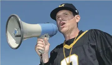  ?? ELIJAH BAYLIS/ASSOCIATED PRESS ?? Jim Harbaugh’s approach to coaching tends toward the conservati­ve, but his recruiting is another story, Among his tactics: He or his assistants swarm the land, invading other schools’ turf.