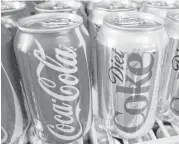  ?? Associated Press f ile ?? Coca-Cola says it wants to recycle a bottle or can for every beverage it sells by 2030. It is also looking to reduce the amount of plastic it uses in bottles.