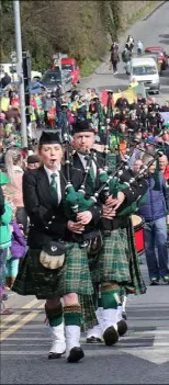  ??  ?? St Coleman’s Pipe Band leading the