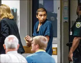  ?? DAMON HIGGINS / THE PALM BEACH POST ?? Victor Fuentes, 20, a Salvadoran resident of West Palm Beach, makes his first court appearance Friday at the Palm Beach County Jail on attempted murder charges. Officials say Fuentes is a member of the MS-13 gang.