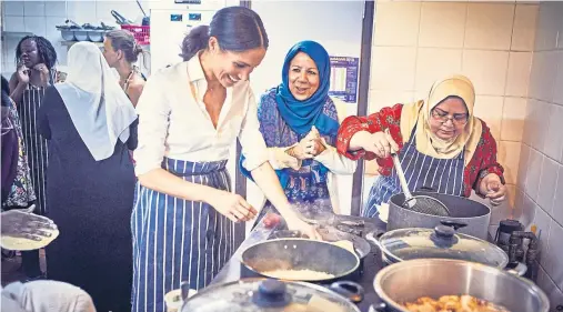  ??  ?? LET’S COOK: The Duchess of Sussex joins women in the Hubb Community Kitchen in West London as they prepare the lunch