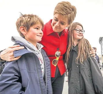  ?? ?? First Minister Nicola Sturgeon at V&A Dundee poses for a photograph with Lewis and Anna Ward, aged seven and nine, on Saturday.